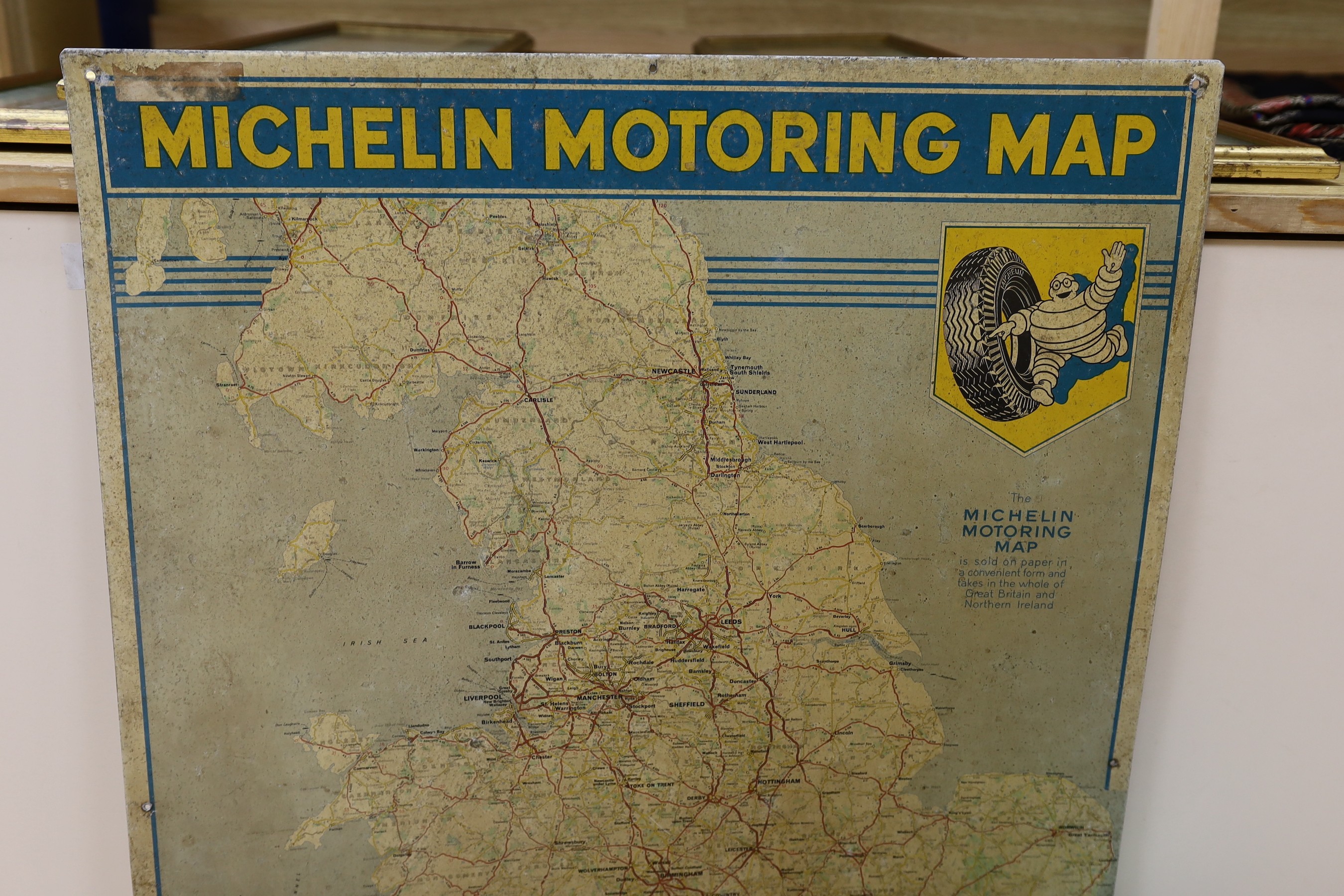 A BP oil can, Michelin motoring map and a revolving globe.